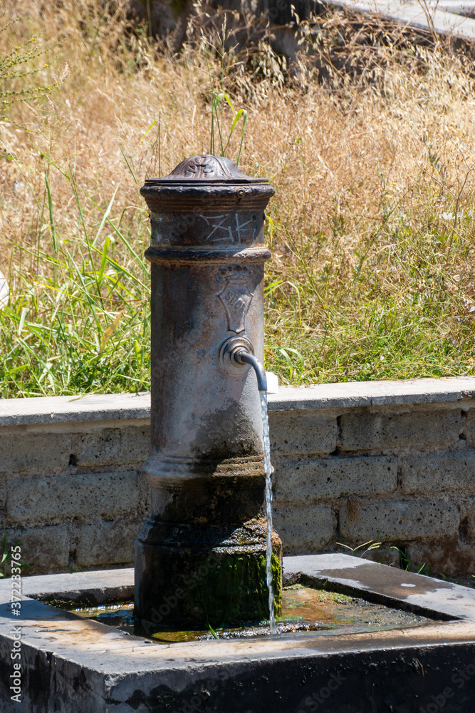 Drinking water fountain known as nasone (big nose) in Rome, Italy Drinking water fountain known as nasone (big nose) in Rome, Italy