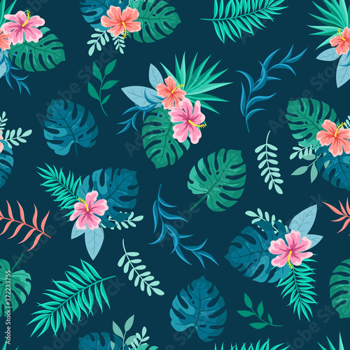 Bouquets of hibiscus, tropical flowers and palm leaves on a blue background. Botanical illustration, textile summer seamless pattern.