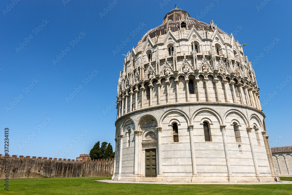 Pisa Baptistery (Battistero di San Giovanni) in Romanesque Gothic style, Piazza dei Miracoli (Square of Miracles). Tuscany, Italy, Europe