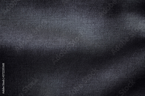 Close up of dark tencel fabric. Tencel (Lyocell) is a form of rayon that consists of cellulose fibre made from dissolving pulp. Top view. Copy space.	