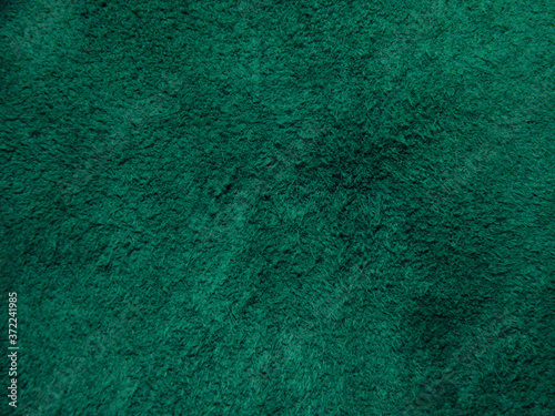 Background of dark purple suede fabric closeup