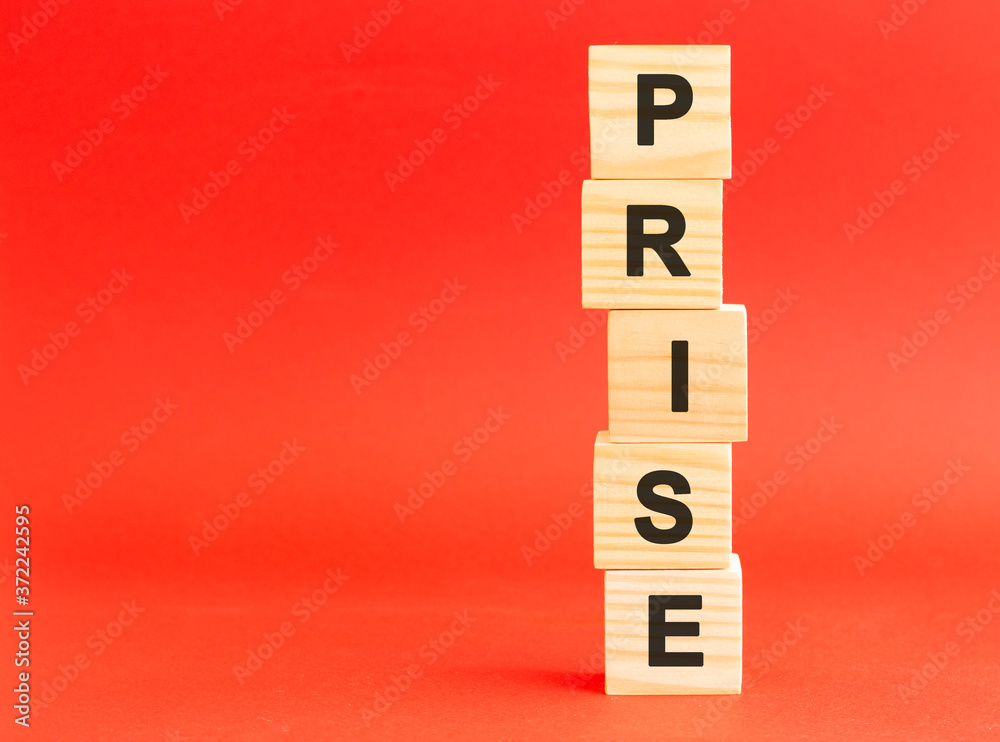 Wooden cubes with letters. For your design, concept. Wooden cubes on a red background. Free space on the left. Wooden cubes with letters. For your design, concept. Wooden cubes on a red background. Free space on the left.