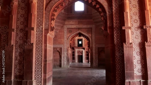 a gimbal stabilized clip walking west in buland darwaza gate at fatehpur sikri near agra, india