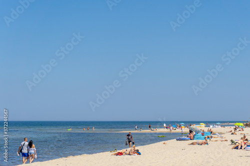 people enjoy a day on the beach in Wolinski National Park on the Baltic Sea