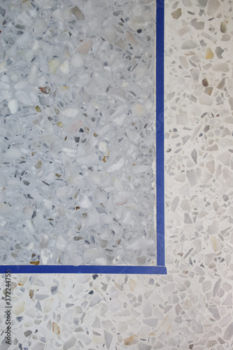 Gray terrazzo floor with separate line. Interior texture background and construction concept. Vertical.
