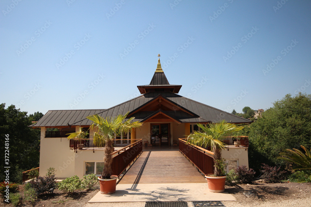 Obraz premium Buddhist Temple located on countryside of Italy,to practice Buddhist monasticism and its meditative practices, according to the normative standards of Buddhism