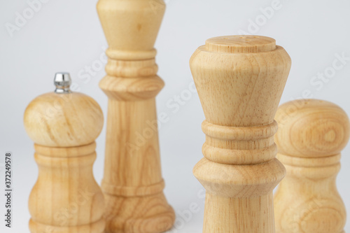 Wooden mills with salt and pepper on white