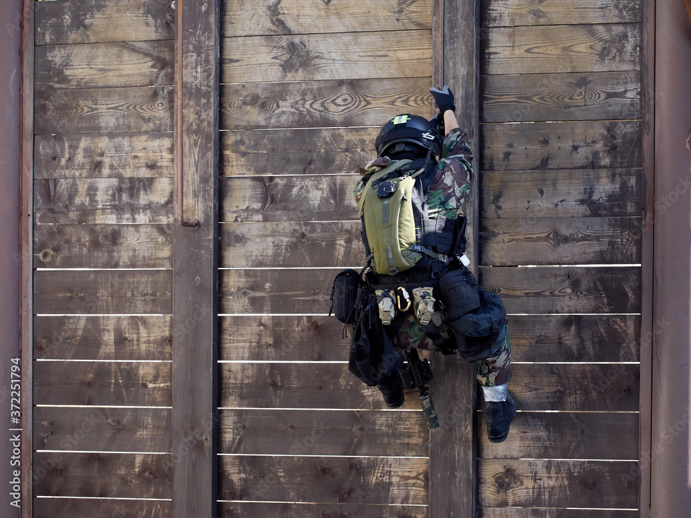 Special forces soldiers storm the walls