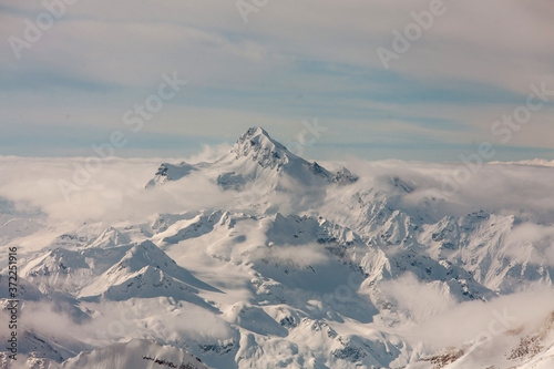 snow-capped Caucasus mountains from a height © Kamil