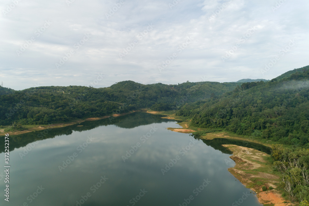 Landscape Aerial view drone shot of mountain around the dam tropical rainforest in thailand Landscape Aerial view drone shot of mountain around the dam tropical rainforest in thailand