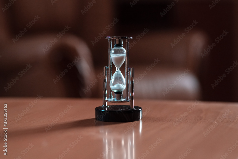the hourglass on the table