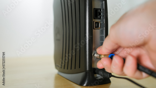 Tableau sur toile Connecting coaxial cable to cable modem