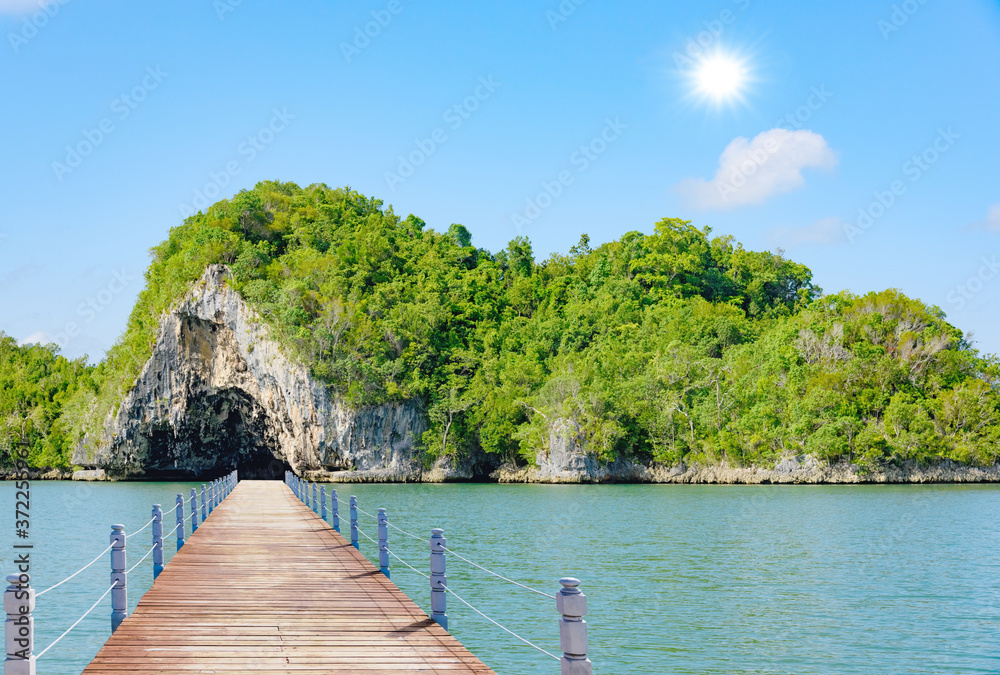 Fototapeta premium wooden bridge juts out into of the sea