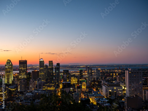 Montreal sunrise viewed from Mount Royal with city skyline in the morning