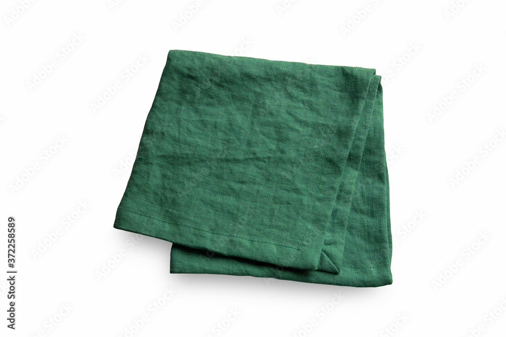 One single green linen organic raw cotton serving napkin or kitchen square form folded. Rough texturized cloth fabric laying isolated on white background. Table setting tissue top view