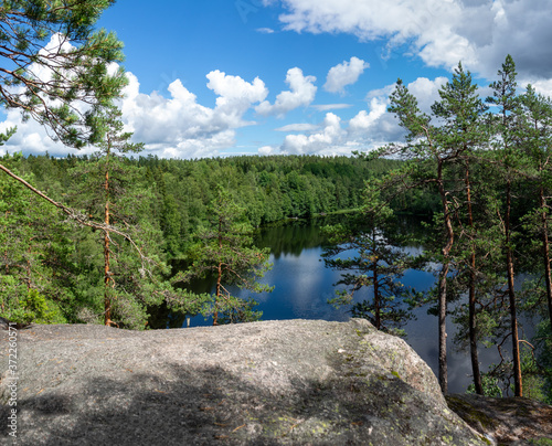 Summer lake scene at hiking trail in Nuuksio national park, Espoo, Finland. photo