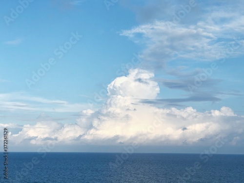 Bright blue sky with white cumulus clouds and skyline. Looks relaxation view for travelling to Atlantic ocean, concept of vacations, Summer in Myrtle beach, SC USA.