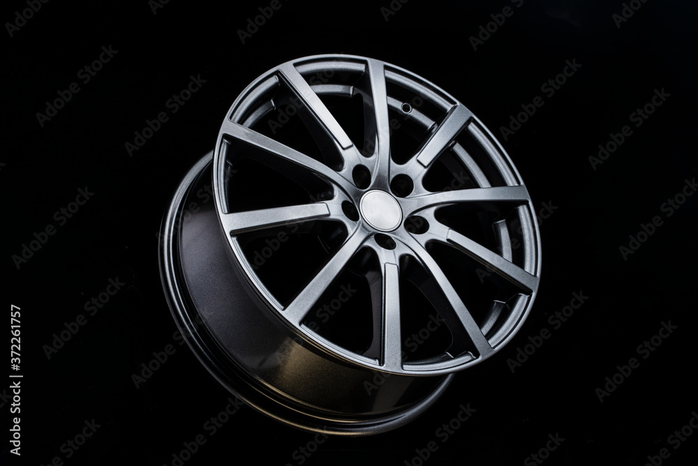 grey Matt caluminum alloy wheel disc on black background. Sports a lot of spokes