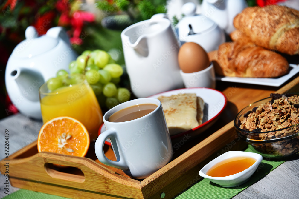 Breakfast served with coffee, juice, croissants and fruits