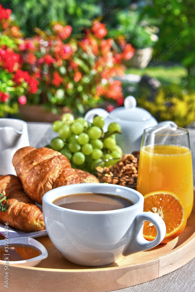 Breakfast served with coffee, juice, croissants and fruits