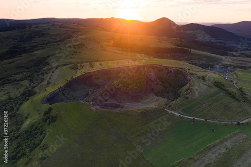 Volcanic crater of Racos village, Transylvania, Romania - drone view