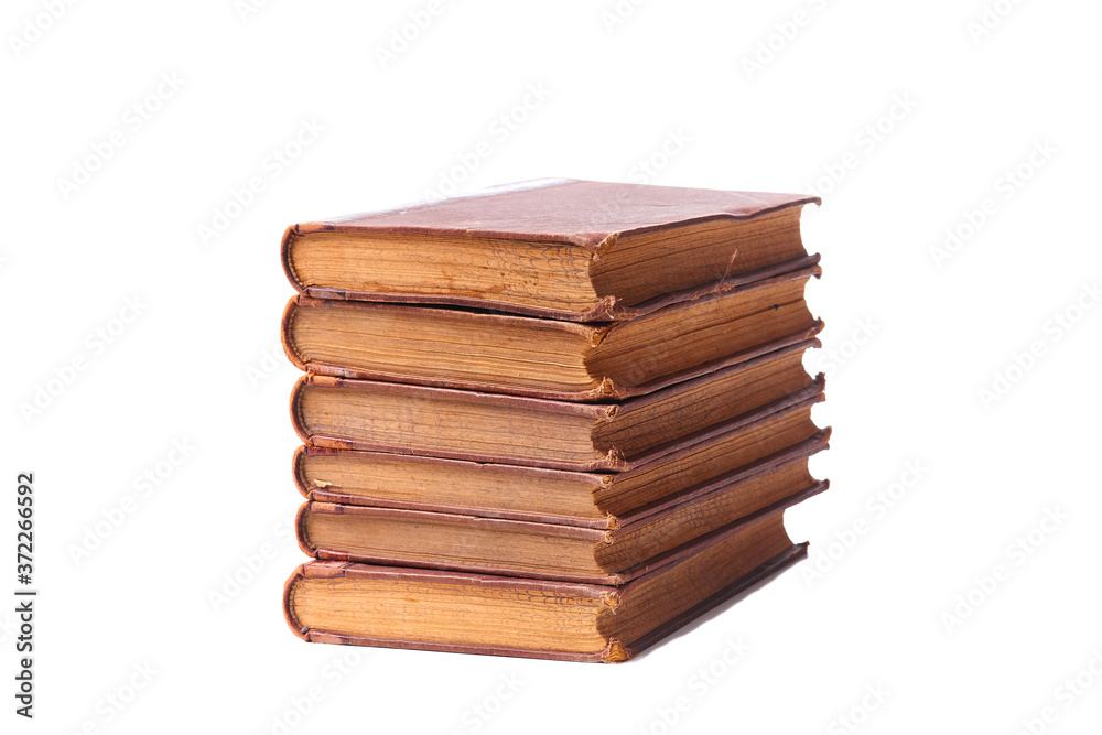 Stack of nine antique books, isolated white background Stack of nine antique books, isolated white background