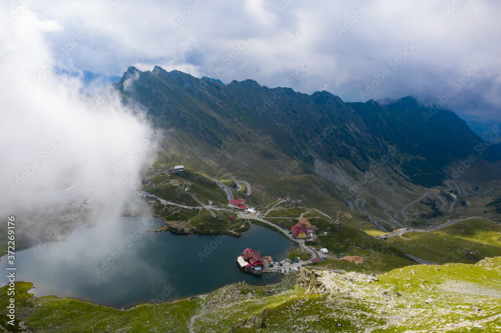 Panoramic view of glacial Lake Balea with Transfagarasan road in most famous place of Romania