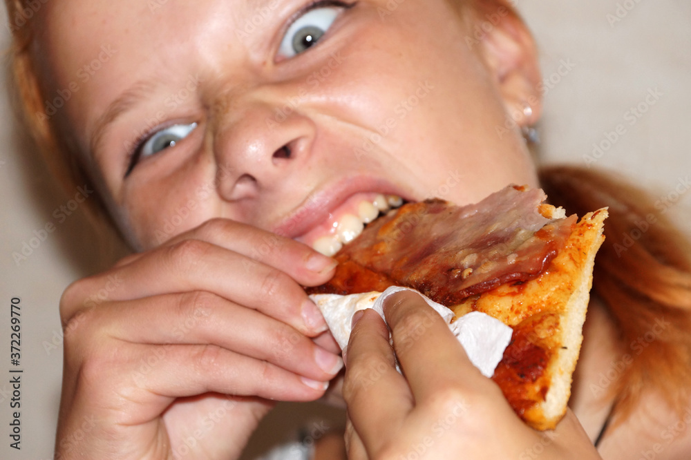 girl greedily eating pizza close up girl greedily eating pizza close up