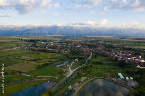 Fototapeta Naklejka Na Ścianę i Meble -  Carta village and the Fgaras mountains in Romania.