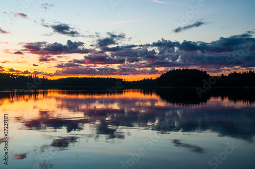 Fototapeta Naklejka Na Ścianę i Meble -  gorgeous evening landscape with clouds reflecting in the water surface