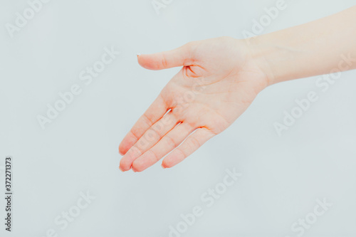 Woman stretches out her hand for handshake