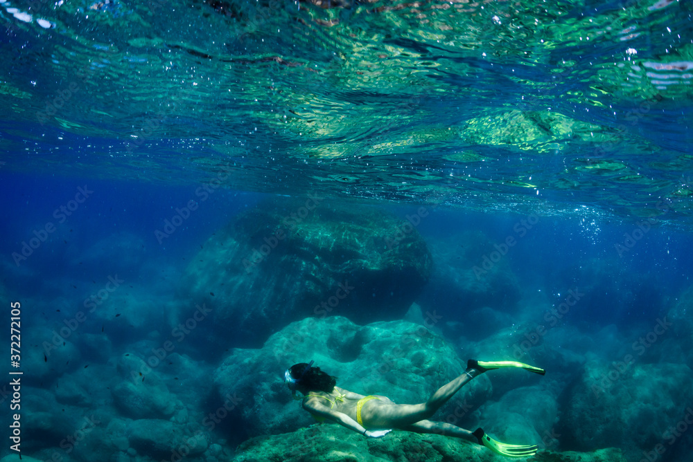 A young woman is diving A young woman is diving