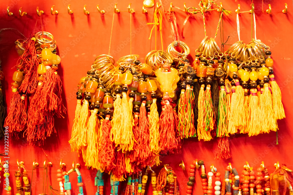 Fototapeta premium Tibetan ornaments on display at local market , Leh, Ladakh, India. These ornaments are traditional festive dresses for Ladakhi people.