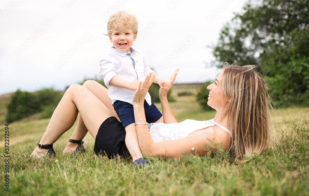 Fototapeta premium Happiness mother with her baby son on the day time