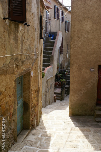 An alley in the historic center of Giglio Castello, Tuscany (Italy)