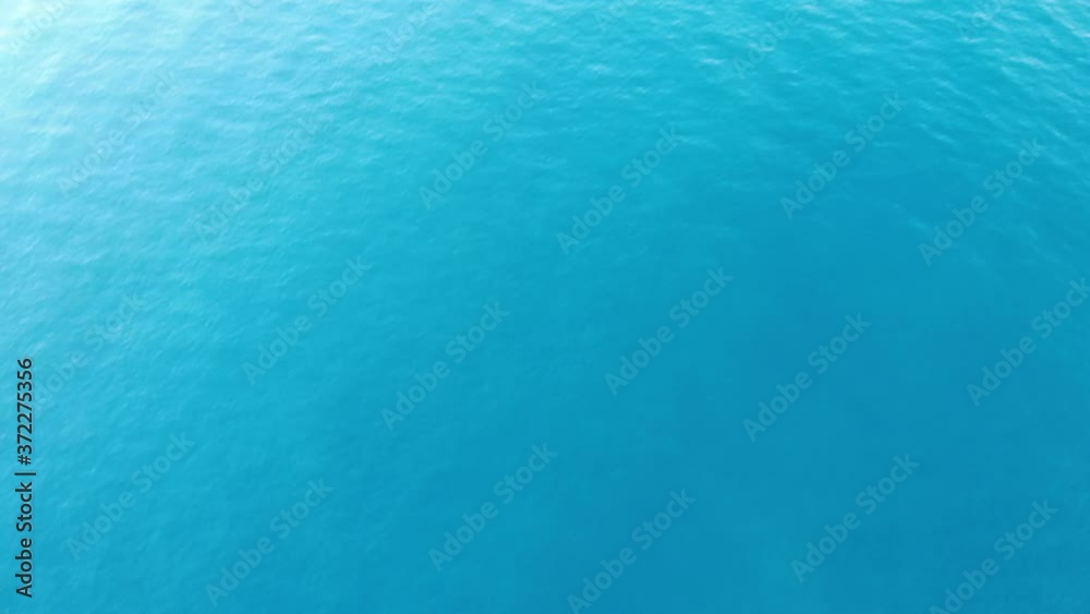 Flight over ocean, open sea. Dynamic aerial shot, after camera tilt - Mediterranean sea Flight over ocean, open sea. Dynamic aerial shot, after camera tilt - Mediterranean sea