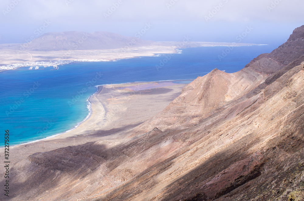 Risco beach surrounded by cliffs on Lanzarote, Spain Risco beach surrounded by cliffs on Lanzarote, Spain