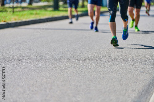 Runners on city road. photo