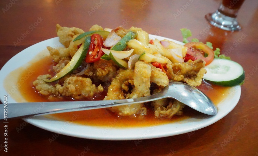 Sweet and sour calamari, the basic ingredients of squid and fresh vegetables with soy sauce