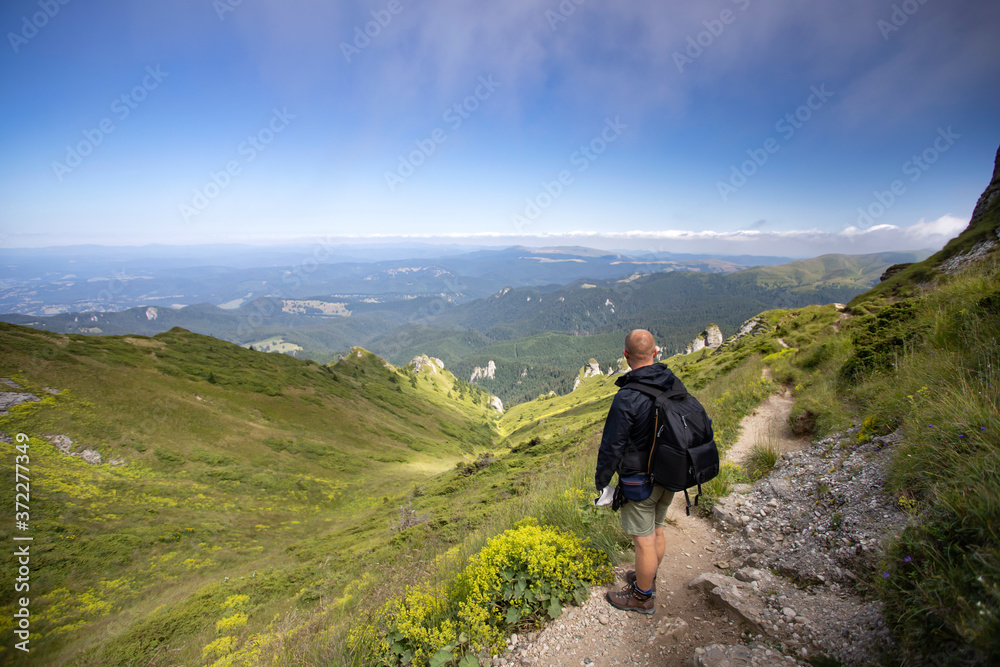 Young hiker backpacker in romanian Ciucas mountains. Young hiker backpacker in romanian Ciucas mountains.