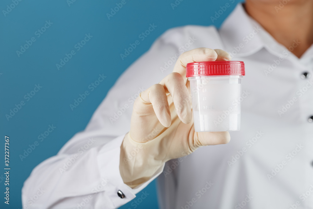 Semen analysis in a Bank is held in the hand of a doctor. Infertility. Semen analysis in a Bank is held in the hand of a doctor. Infertility.