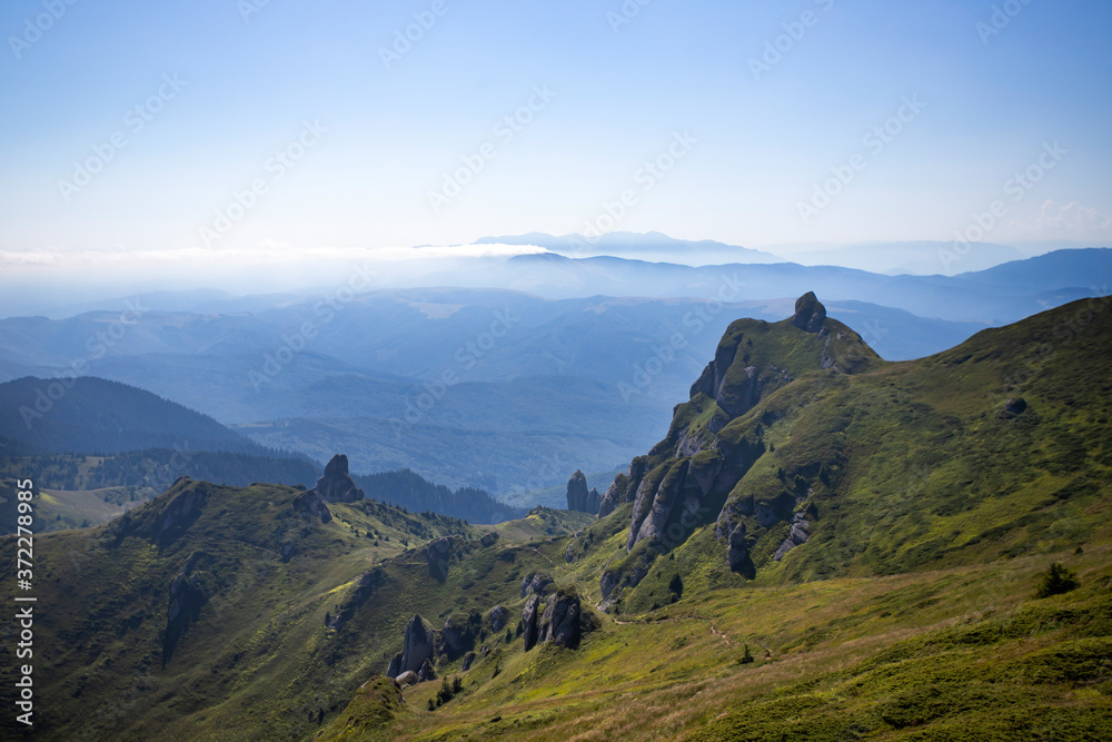 Most scenic mountain from Romania, Ciucas mountains in summer mist.