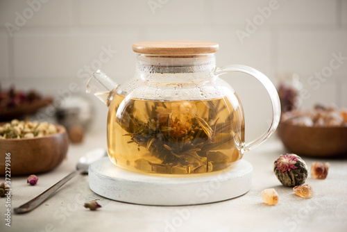 brewed tea flower in a glass teapot