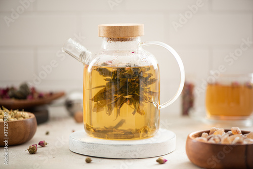 brewed tea flower in a glass teapot