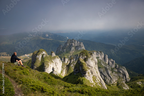 Young hiker backpacker in romanian Ciucas mountains.