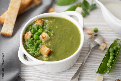 green pea puree soup with croutons