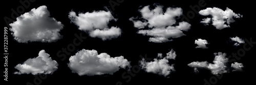 Clouds set isolated on black background. White cloudiness, mist or smog background. Design elements on the topic of the weather. White cloud collection. photo