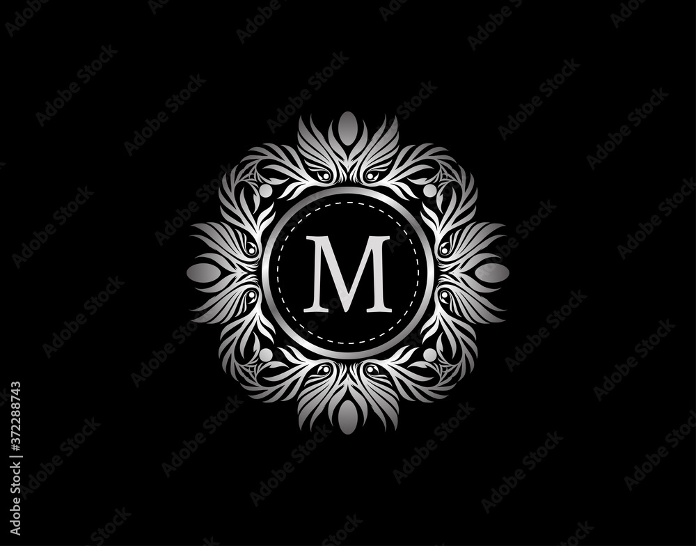 Luxury Silver Badge M Letter Logo. Luxury calligraphic vintage emblem with beautiful classy floral ornament. Vintage Heraldic Frame design Vector illustration. Luxury Silver Badge M Letter Logo. Luxury calligraphic vintage emblem with beautiful classy floral ornament. Vintage Heraldic Frame design Vector illustration.