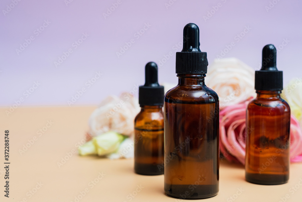 Creating homemade cosmetics with natural extracts. Serum with roses petals. Skin care concept. Natural organic homemade cosmetics concept