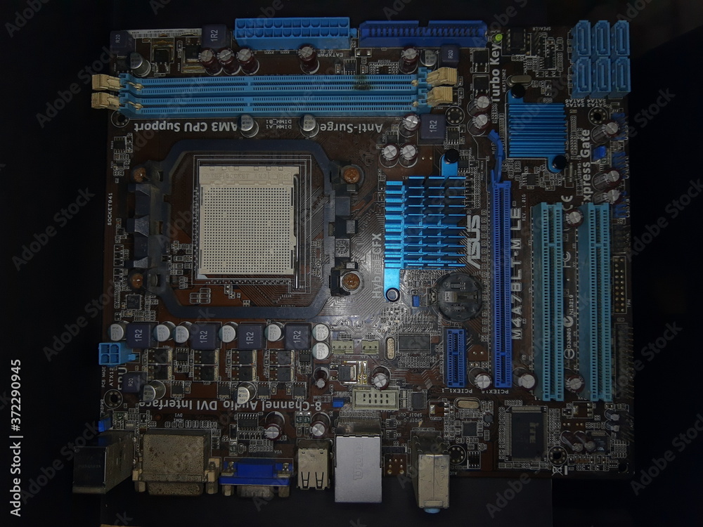 Fototapeta premium Computer Hardware. Motherboard, A close-up microchip with many electrical components placed on the Board